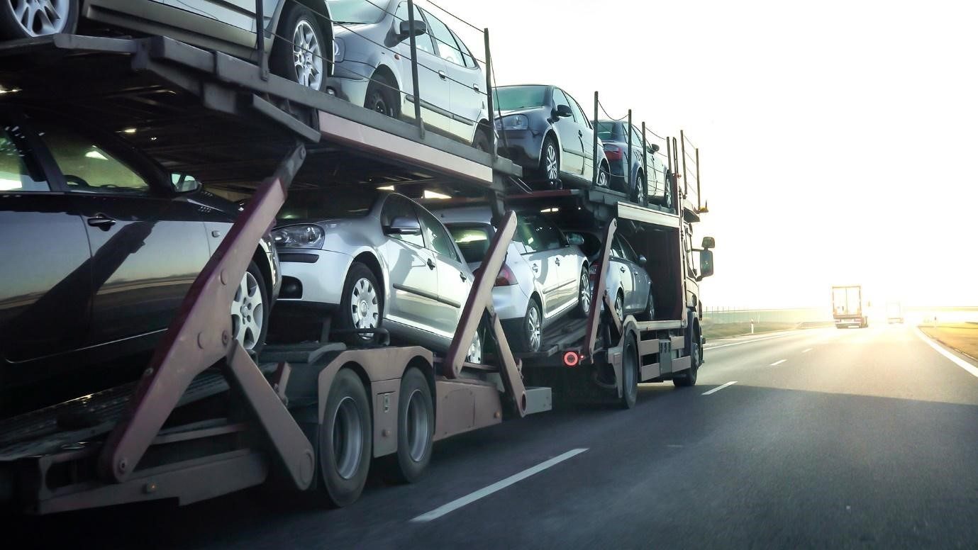 Car carrier truck transporting used cars to a Japanese export port