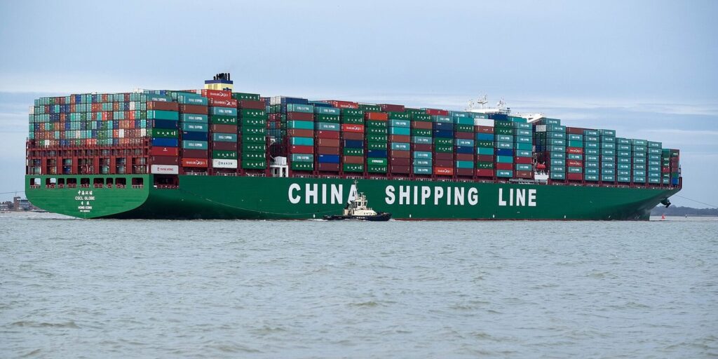 Container ship at sea carrying export cargo
