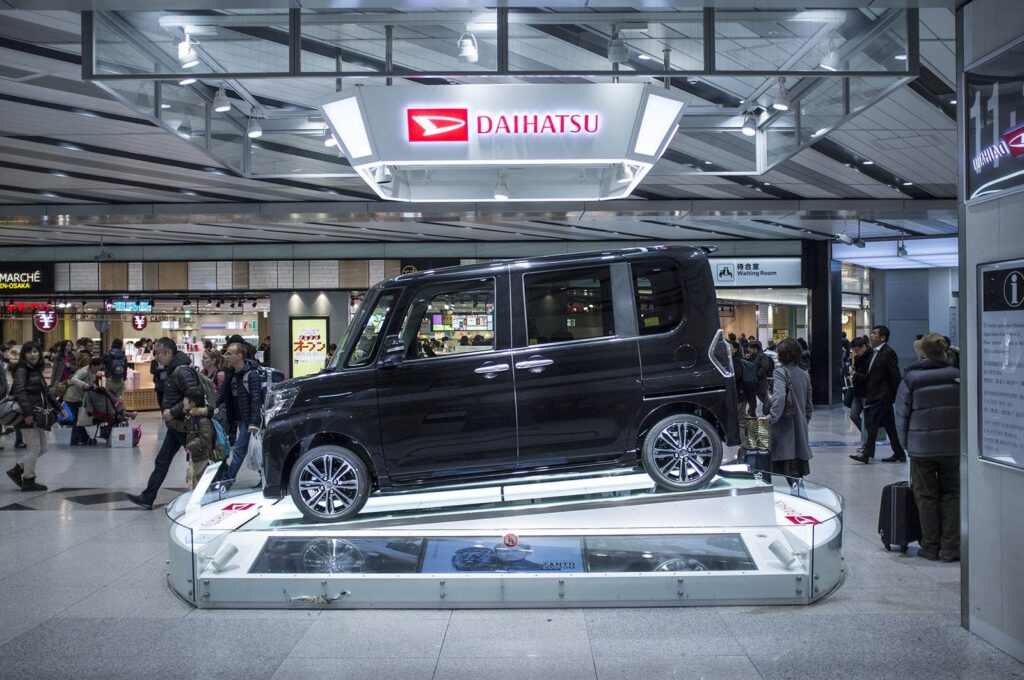 Daihatsu van on display in a Japanese showroom