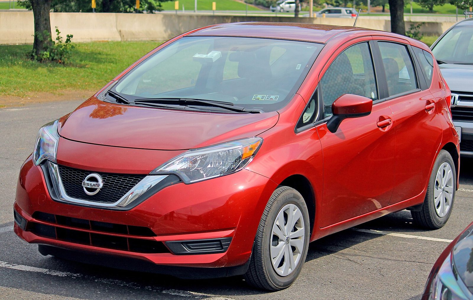 Red Nissan Note hatchback from Japan