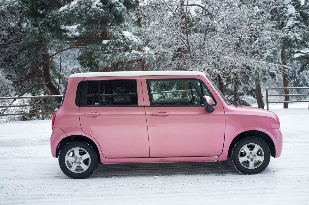 Pink Suzuki Lapin kei car in Japan