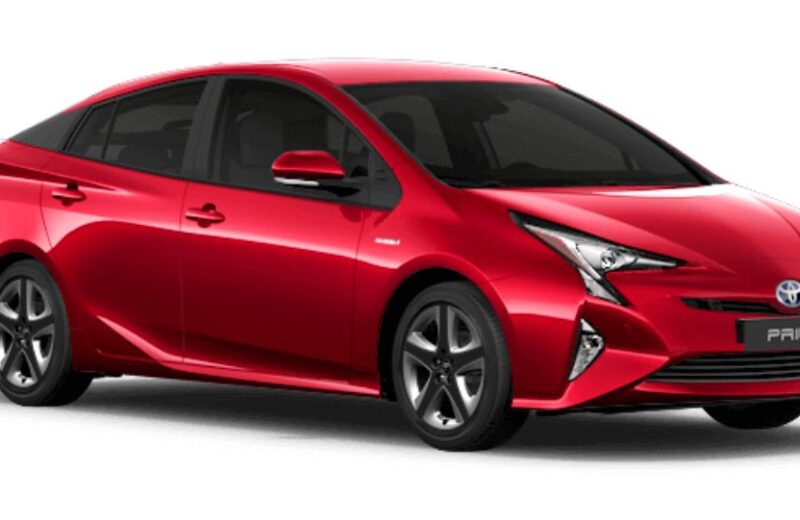 Red Toyota Prius hybrid, a popular used car from Japan