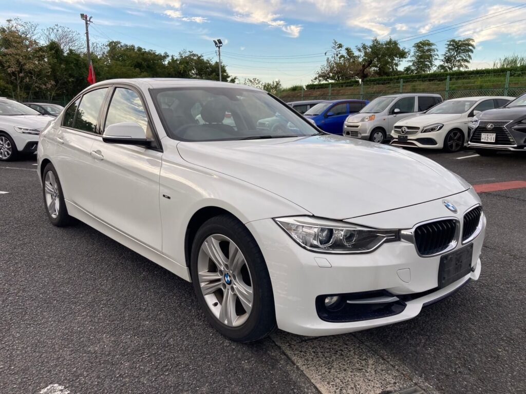 White sedan in a Japanese used car stock yard